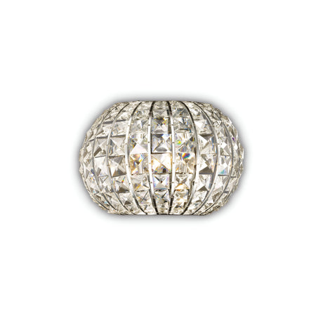 The Auroral Wall Light - Chrome, featuring a spherical design with intricately arranged reflective square facets, produces a dazzling and luminous effect. Enhanced with a dimmable feature, its metallic frame sparkles brilliantly from various angles, offering customizable brilliance for any space.