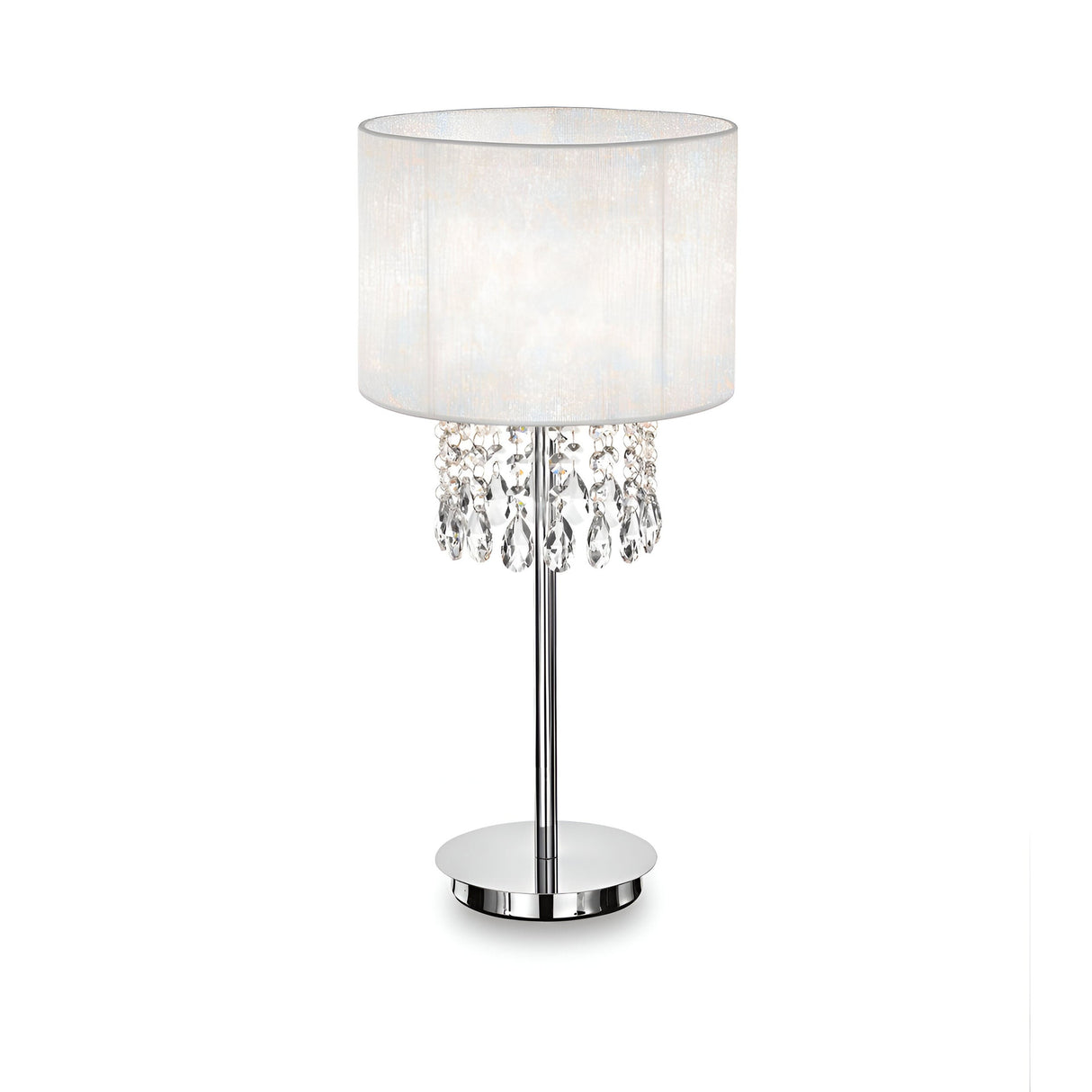 The Brillis Crystal Table Lamp - White boasts a sleek silver stand and round base complemented by a cylindrical white fabric shade. Below the shade, decorative crystal droplets enhance its modern design, adding an elegant touch to the ambient atmosphere.