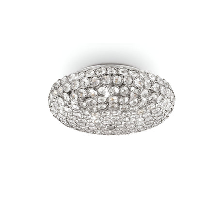 The Queen 5 Light Crystal Ceiling & Wall Light - Chrome fixture, embellished with numerous crystal-like accents, offers a sparkling appearance. Its chromed metal rings contribute to a sleek finish, enhancing its elegant and modern design.
