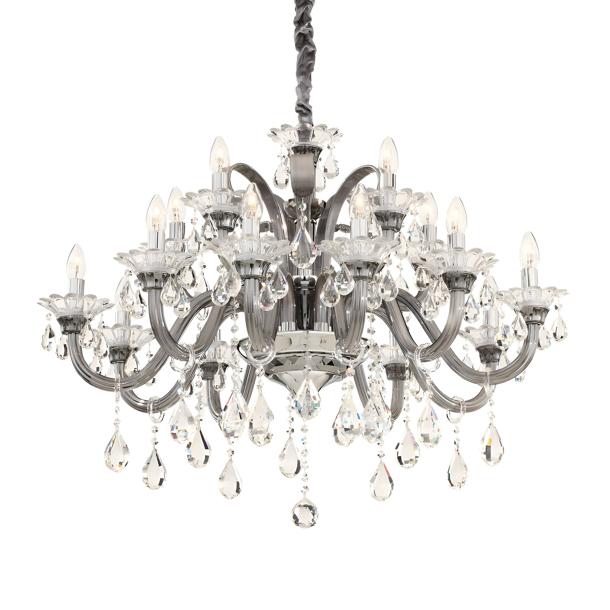 The Vivid Crystal 15 Light Chandelier - Silver features numerous arms decorated with teardrop-shaped crystal pendants. Each arm supports a small light designed to resemble a candle, creating an opulent and illuminated look. This sophisticated piece hangs from a dark braided chain, exuding brilliance and charm throughout the space.