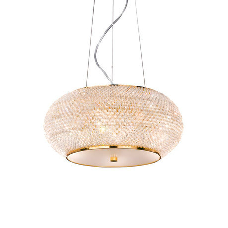 The Harbor Crystal 6 Light Chandelier - Gold elegantly hangs from the ceiling with its luxurious dome shape. This sophisticated piece showcases numerous small, sparkling crystals that serve as a diffuser, casting a warm glow throughout the room. It is suspended by thin wires, adding to its refined charm.