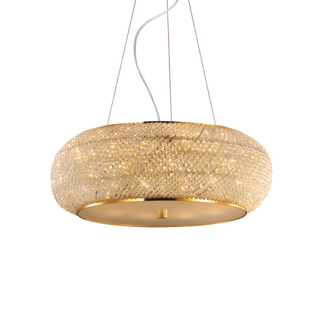 The Harbor Crystal 10 Light Chandelier - Gold is a luxurious lighting centerpiece, featuring intricate crystal detailing and suspended from thin wires, emitting a warm glow.