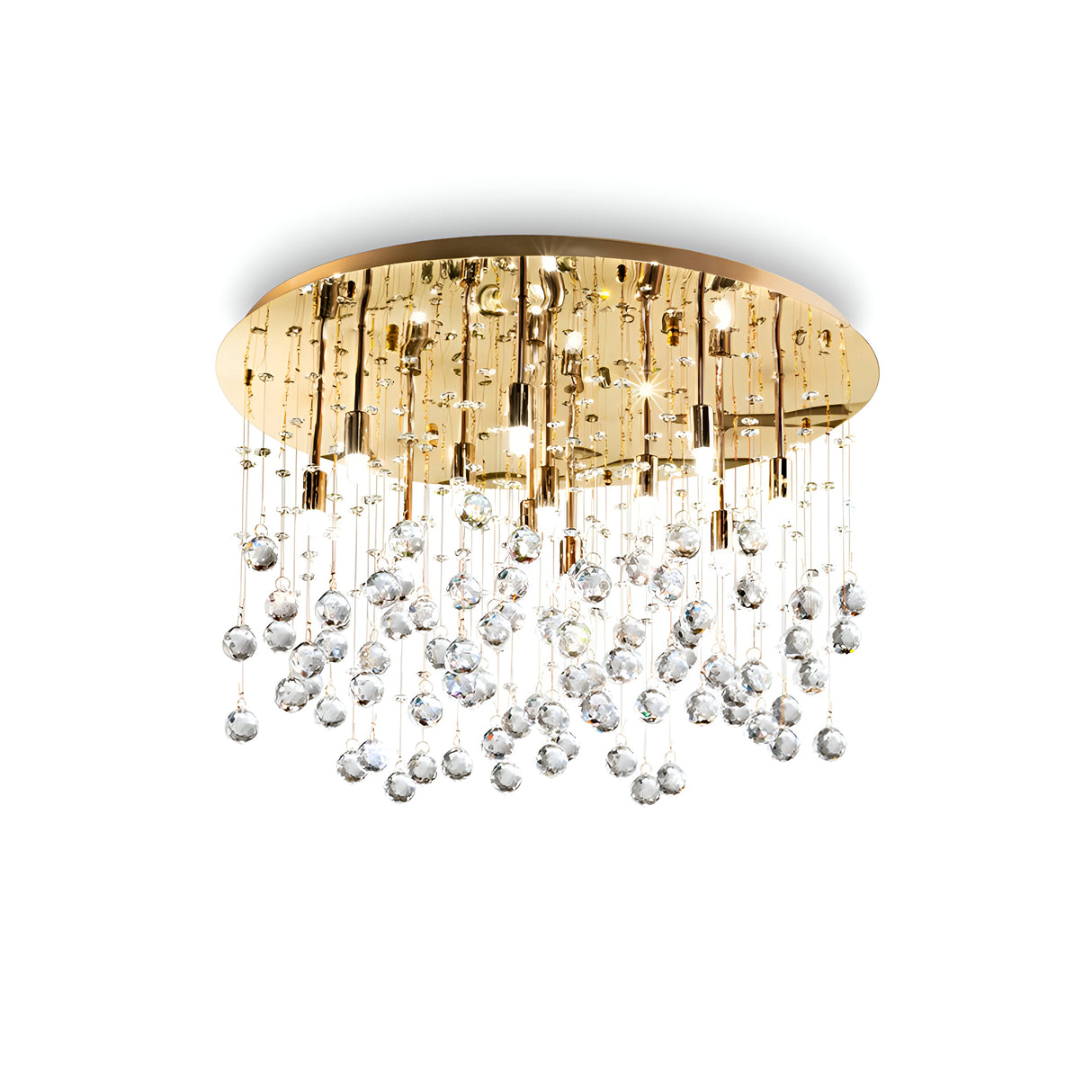The Solisera 12 Light Crystal Semi Flush Chandelier - Gold is a luxurious lighting choice, featuring a gold circular base with cascading crystal orbs suspended from thin wires, creating an elegant and opulent look against a plain background.