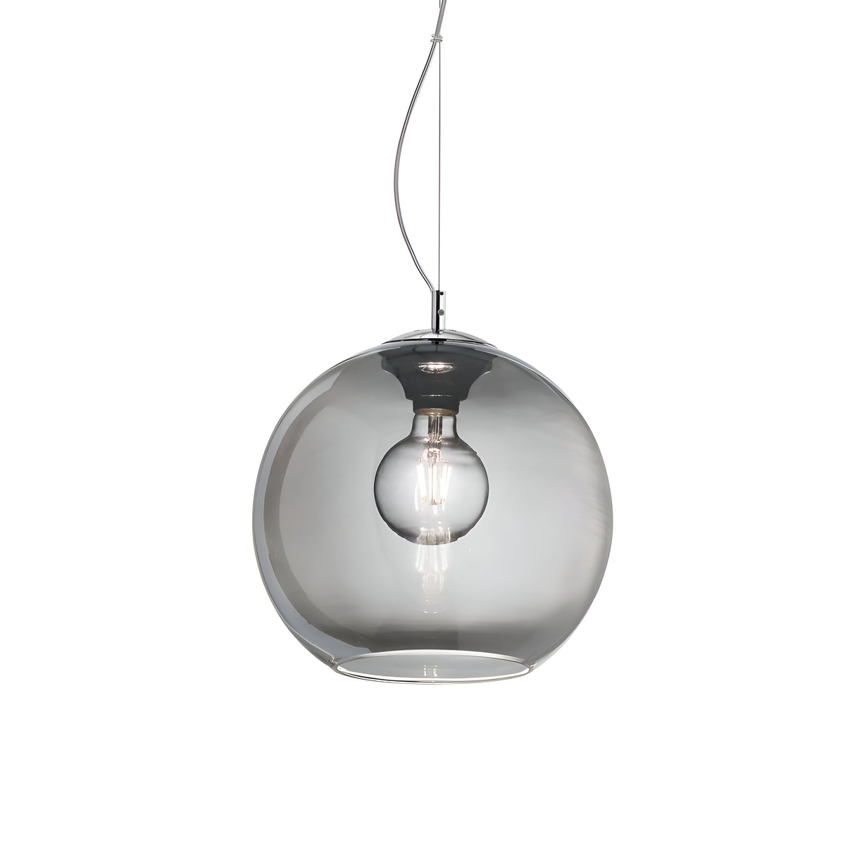 The Emberlyte Small 1 Light Glass Pendant in silver, with its 30cm clear spherical glass shade, elegantly hangs from the ceiling. A visible bulb inside is connected by a sleek cord to the fixture. Its minimalist design offers dimmable lighting, enhancing its contemporary allure.