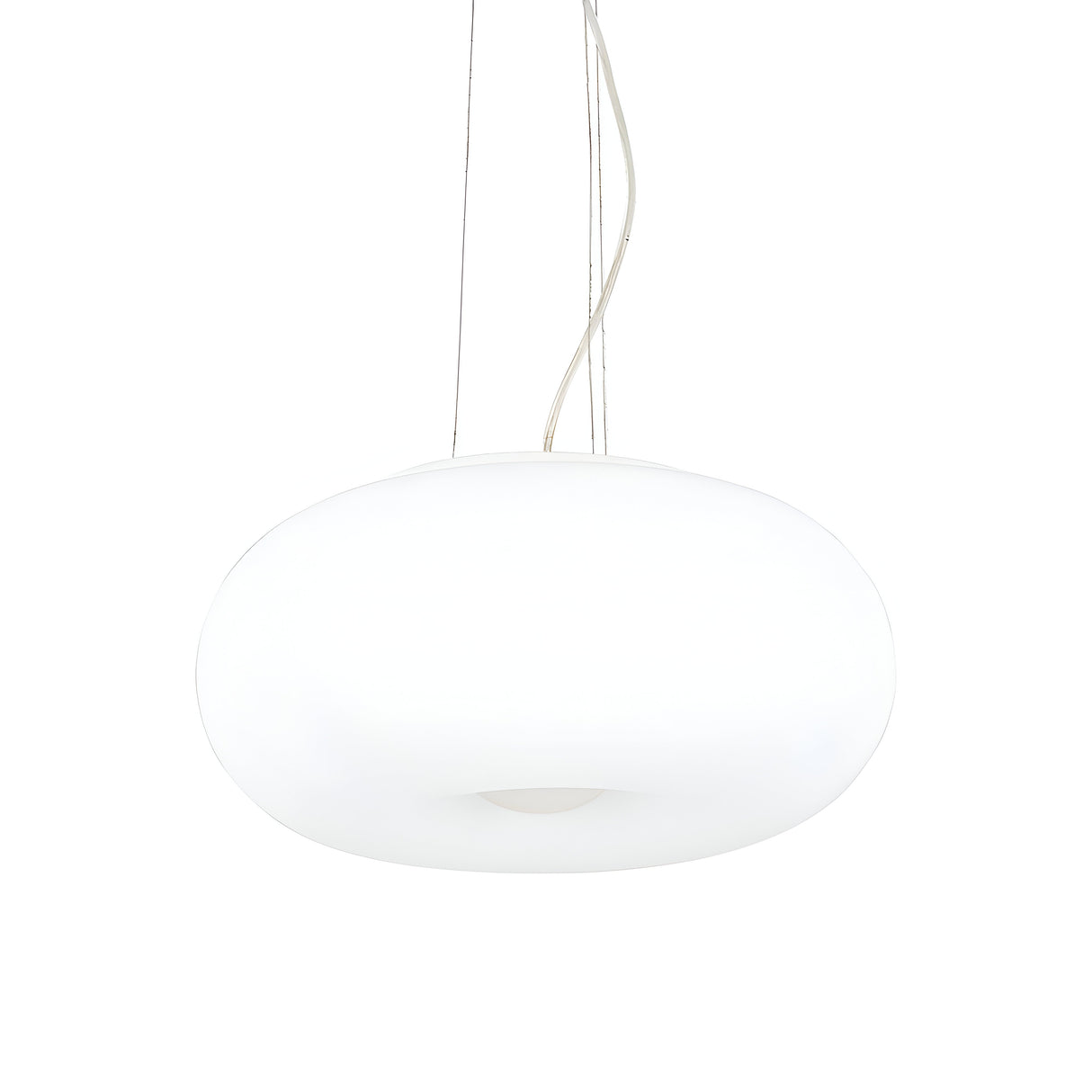 This contemporary lighting piece, the Vail 3 Light Pendant in white with a 42cm oval shape, suspends from the ceiling using slender cables. Its sleek, glossy surface emits a soft glow, complementing a minimalist design and modern aesthetic.