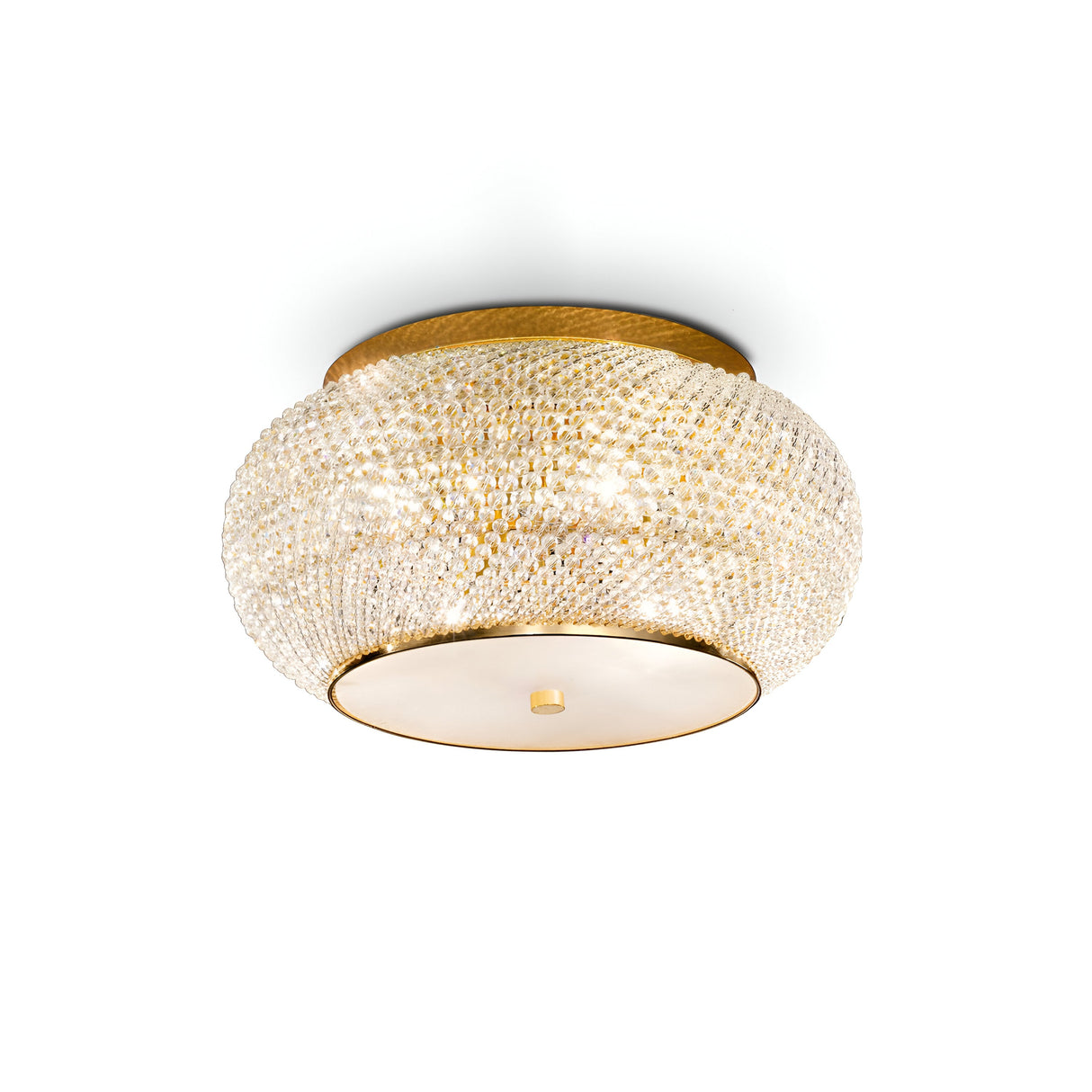 This Harbor 6 Light Crystal Flush - Gold showcases an elegant ceiling-mounted, circular design with a textured gold surface. It features intricate crystal-like details that cast beautiful reflections, and the base plate is adorned with a smooth matte gold finish and a central knob for added sophistication.