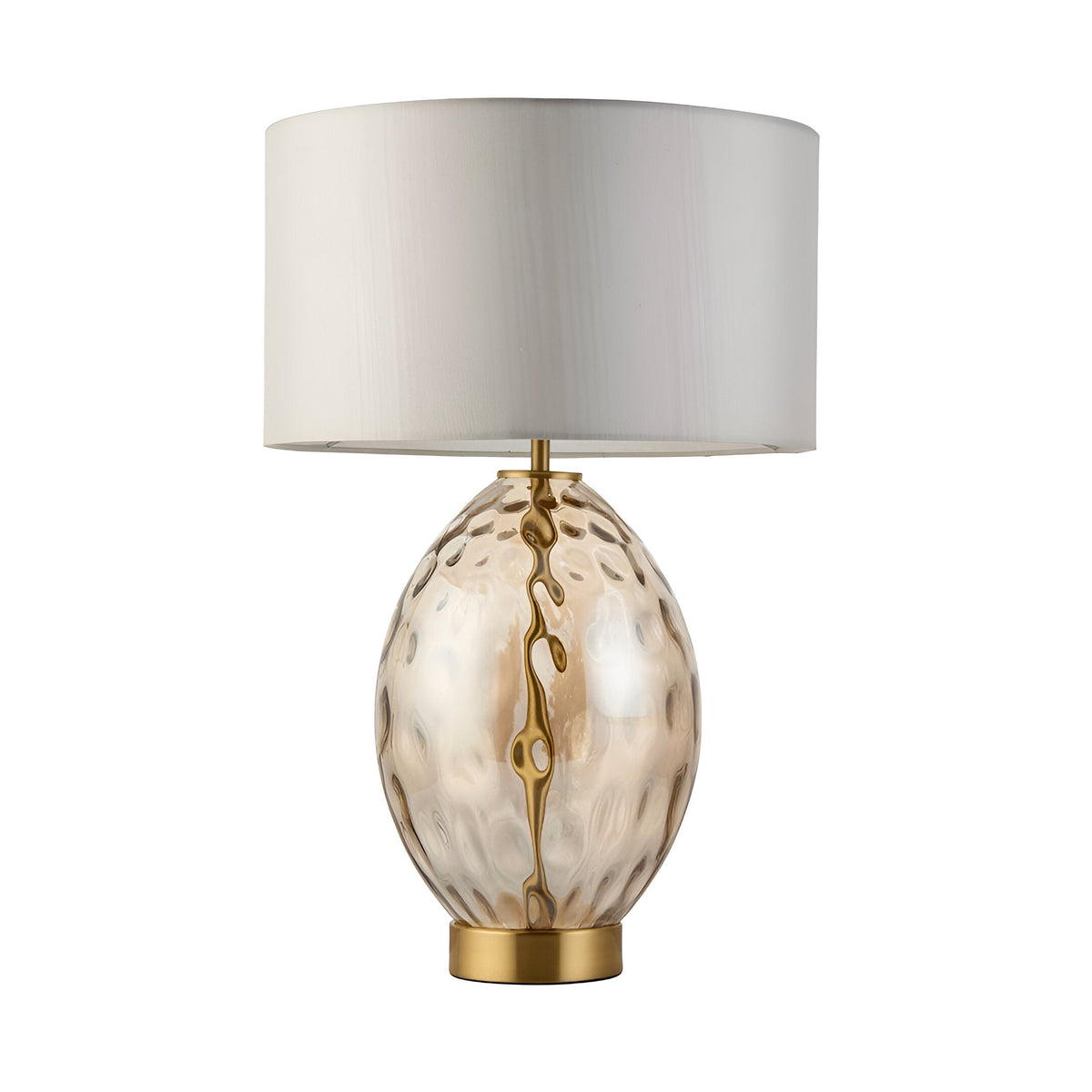 Endon Draycott table lamp with dimpled amber glass ovoid base, satin brass fittings and vintage white fabric drum shade on a plain background.