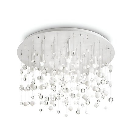 The Illusis 12 Light Glass Semi Flush Chandelier - White, a pinnacle of contemporary design, showcases several small spherical pendants in white and clear glass. These gracefully suspend from slender wires connected to a circular base, offering a modern twist on the classic luxury chandelier with its sophisticated elegance.