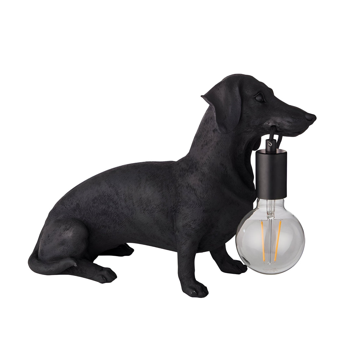 Bevworth Table Lamp in matt black resin, shaped as a seated dachshund holding an E27 filament bulb in its mouth, on a plain white background.