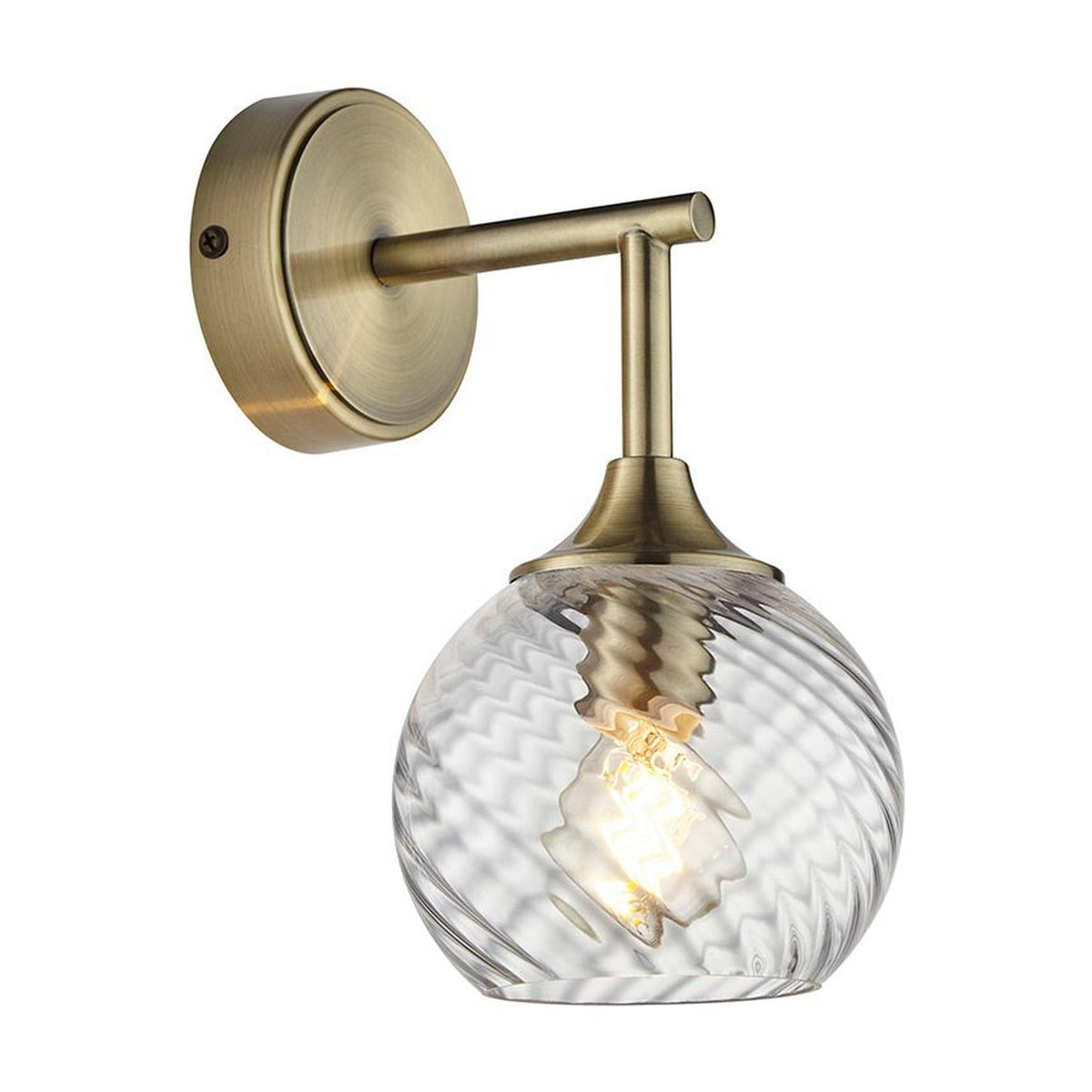 Georgiana Wall Light in Brass, a single-light fitting with round wall plate, angled arm, and twisted spiral-patterned clear glass shade.