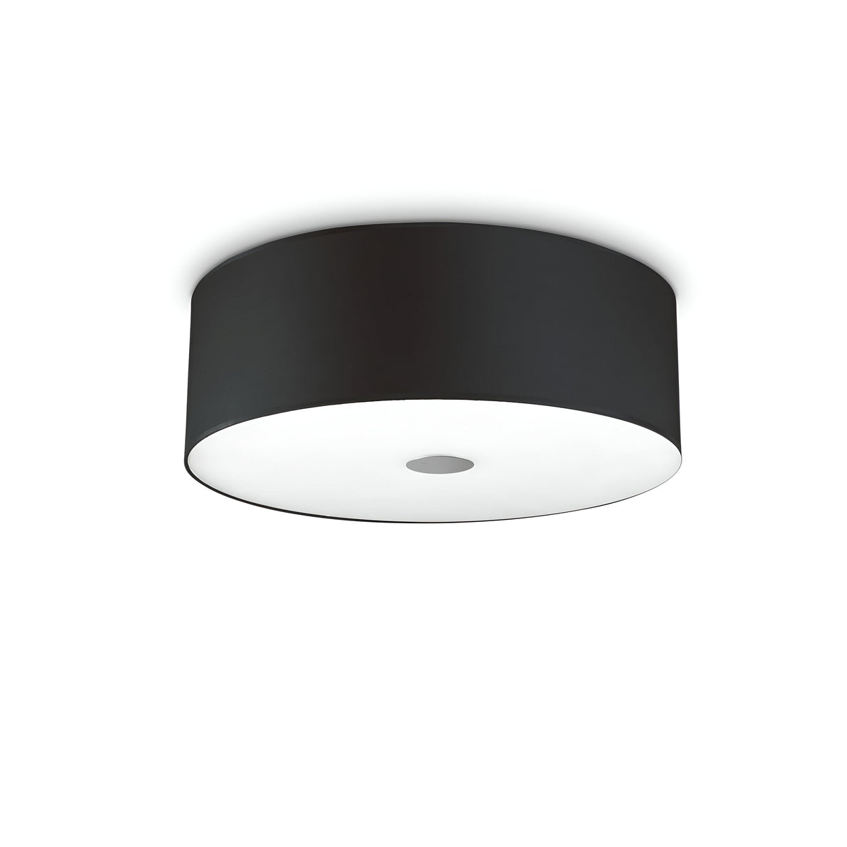 The Noble 4 Light Flush - Black is a modern ceiling light fixture that boasts a flush-mounted design with a sleek black cylindrical shade and features a circular white diffuser at the bottom, creating a soft glow.