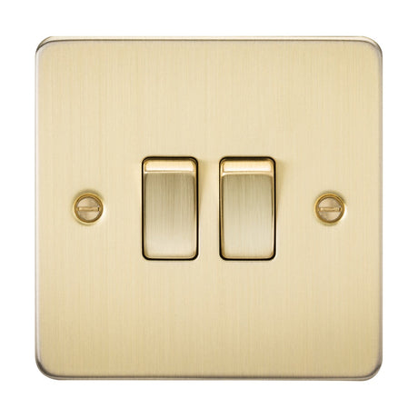 The 10AX 2 Gang 2-Way Switch features a brushed brass flat plate with premium-grade steel, elegantly secured by two visible screws.