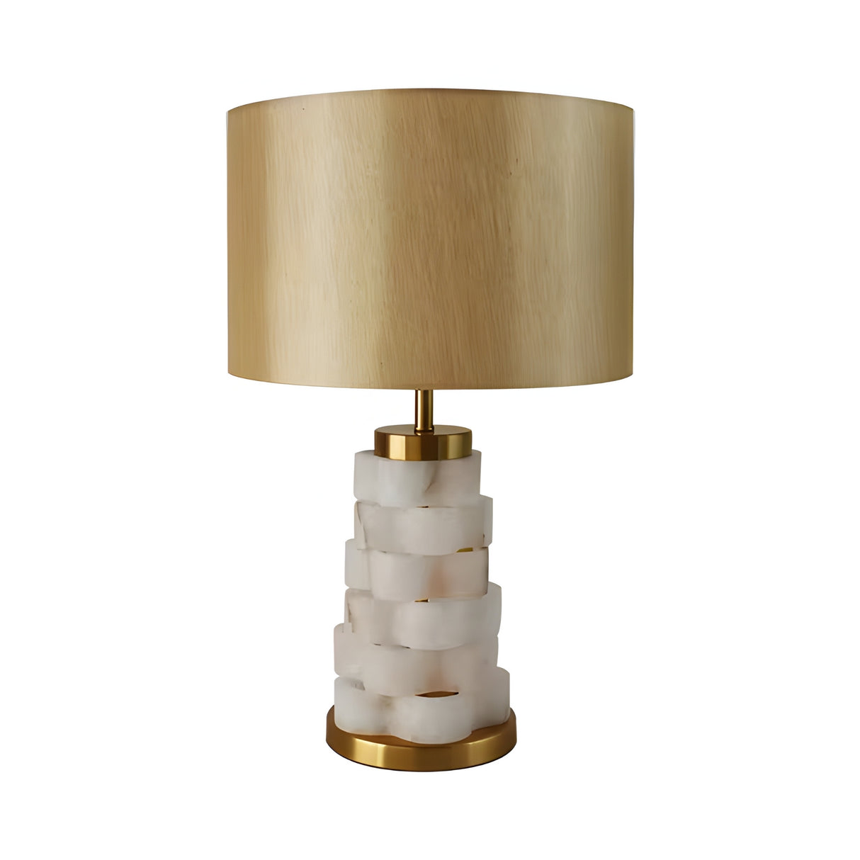 The Solmira 1 Light Stacked Alabaster Table Lamp in brass and soft white features a translucent stacked alabaster base, gold accents, and a wide cylindrical beige lampshade, displayed against a white background.