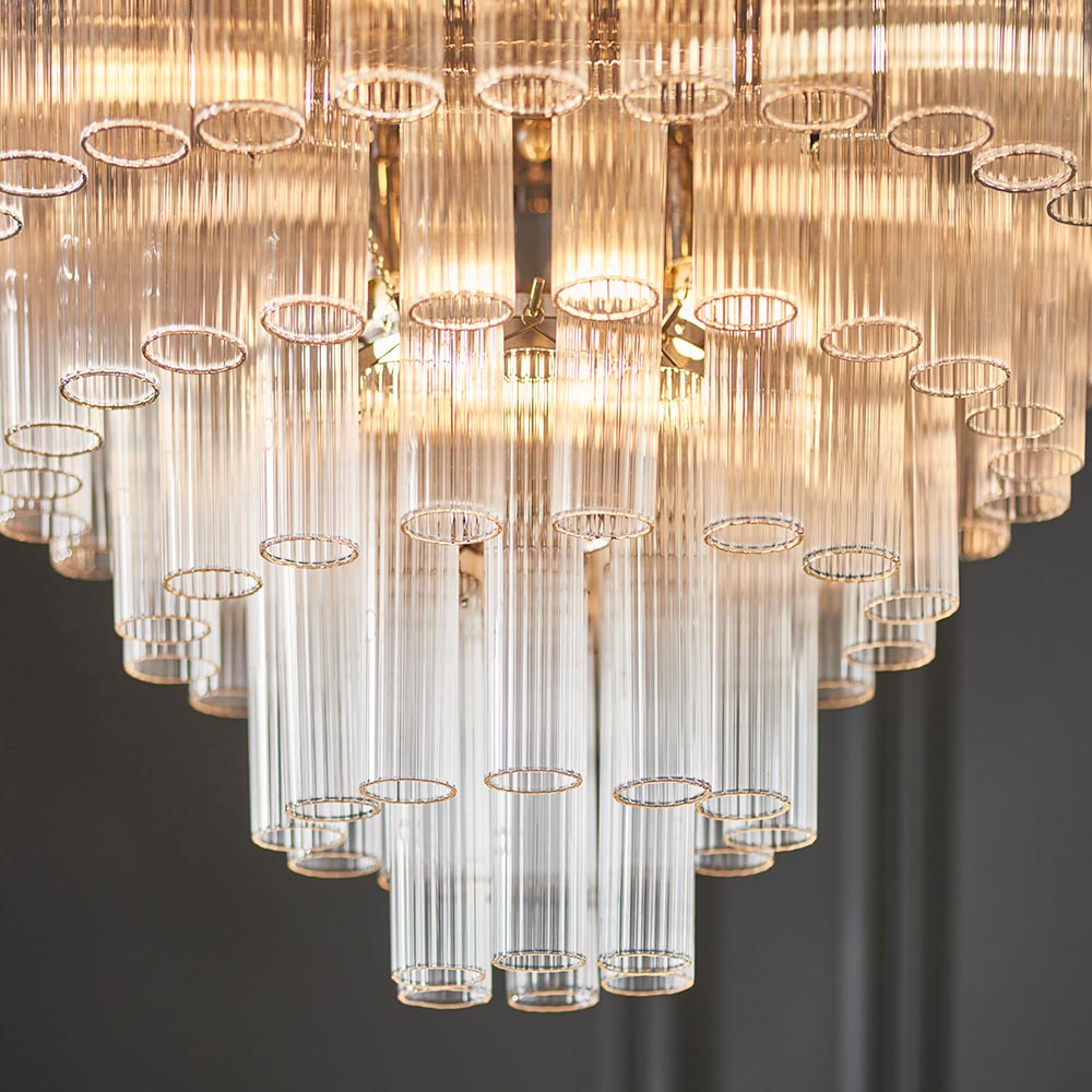 Close-up of Endon Cranshaw 12 Light Tiered Pendant in polished chrome, showing layered ribbed clear glass cylinders arranged in descending tiers.
