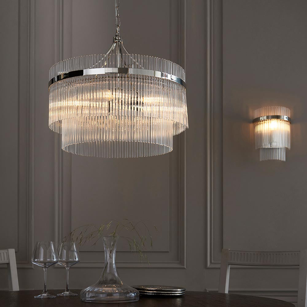 Endon Beaumont nickel wall light with clear glass rods and E14 bulb, shown beside a tiered glass rod chandelier in a panelled dining room.
