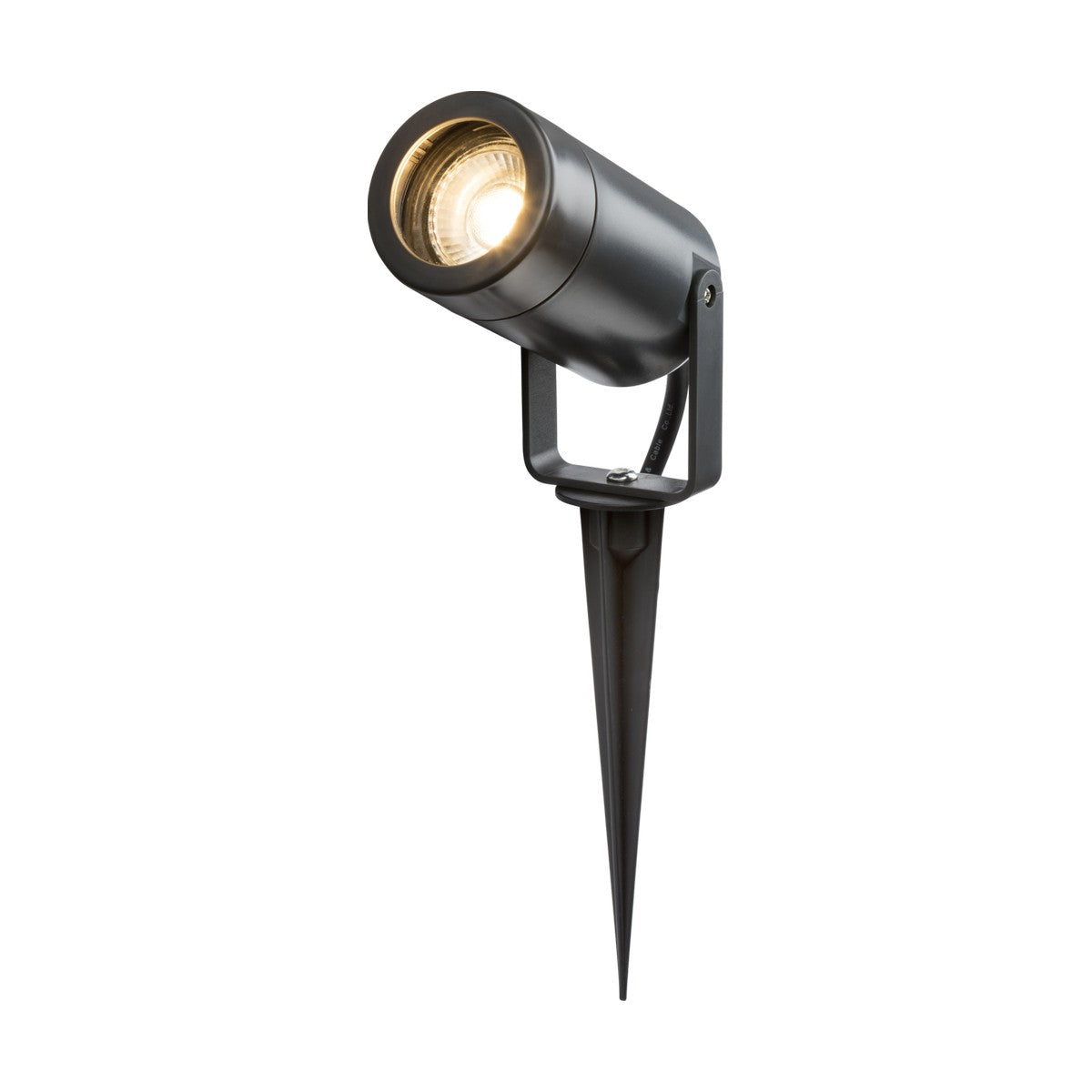 The Eamon Outdoor Spike Light - Anthracite features a sleek cylindrical design with a corrosion-resistant finish. It is mounted on a pointed stake base for easy ground insertion and emits a warm glow.