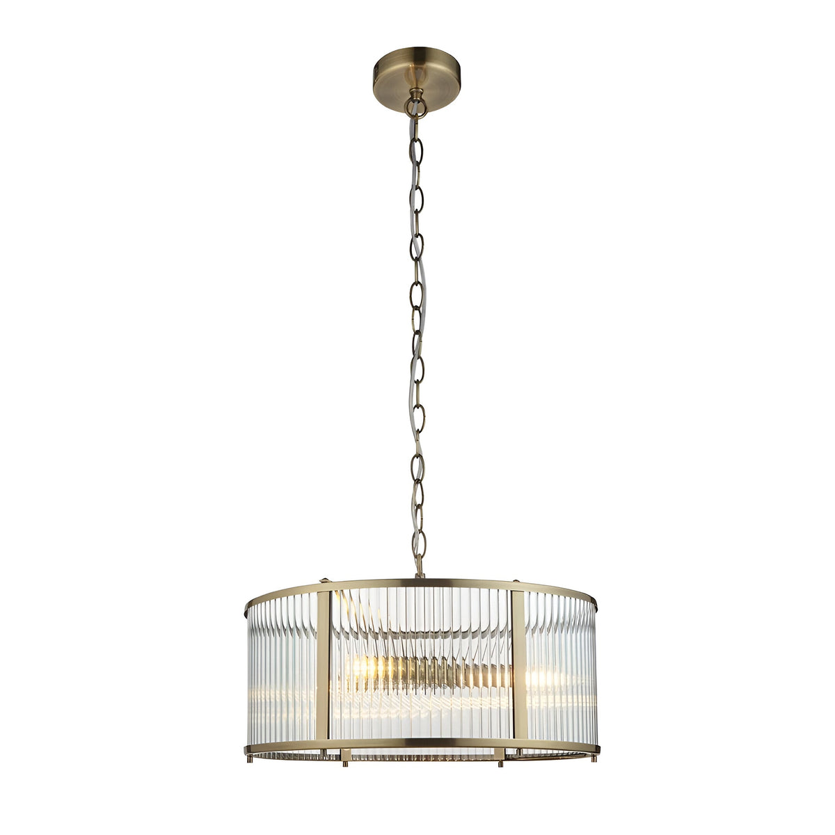 Rothbury 3 Light Pendant in antique brass with a drum frame and clear ribbed glass panels, hung from a chain on a plain white background.