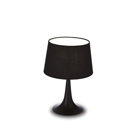 The Arc Small Table Lamp - Black features a wide, round base and a black fabric lampshade that embody a minimalist aesthetic. Positioned perfectly against a white background, it effortlessly complements modern interiors.