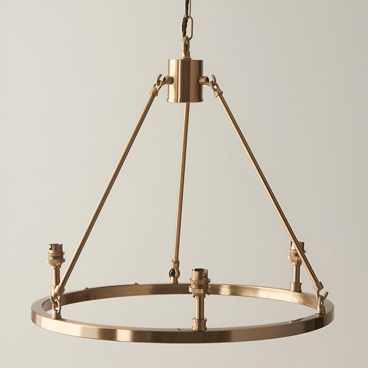 Endon Bevford 3 Light Pendant in aged brass with a hoop frame, three B22 lamp holders, and a black chain suspension on a neutral background.
