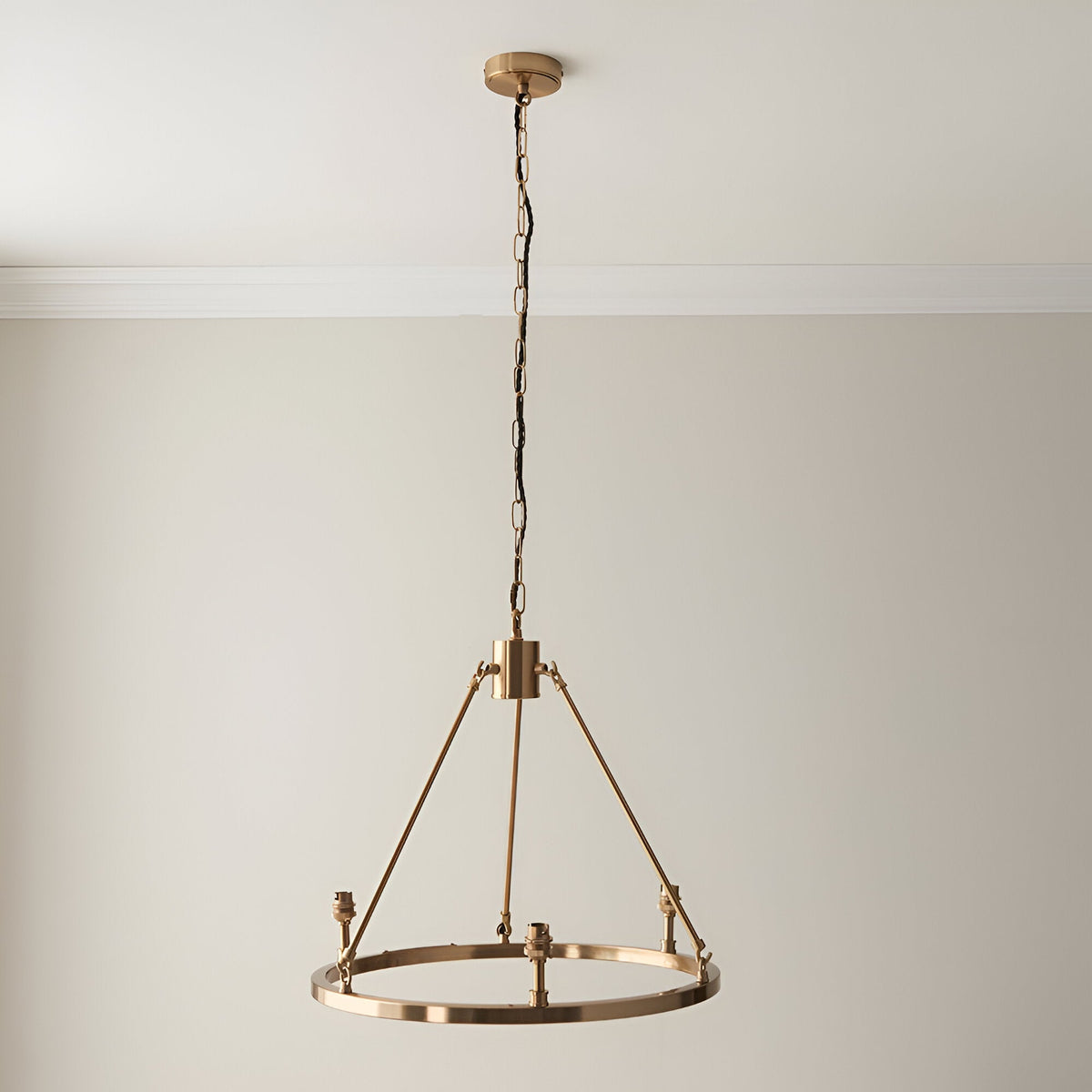 Endon Bevford 3 Light Pendant in aged brass with a hoop frame, B22 lamp holders, and black chain suspension, shown against a plain wall.