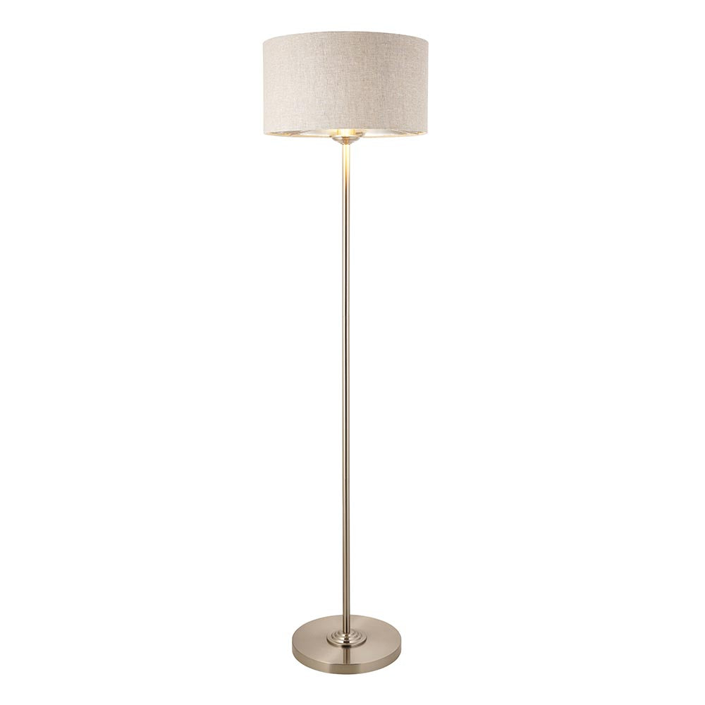 Endon Brenley floor lamp in chrome with a slim metal stem, round base, and natural linen drum shade with metallic inner, on a white background.