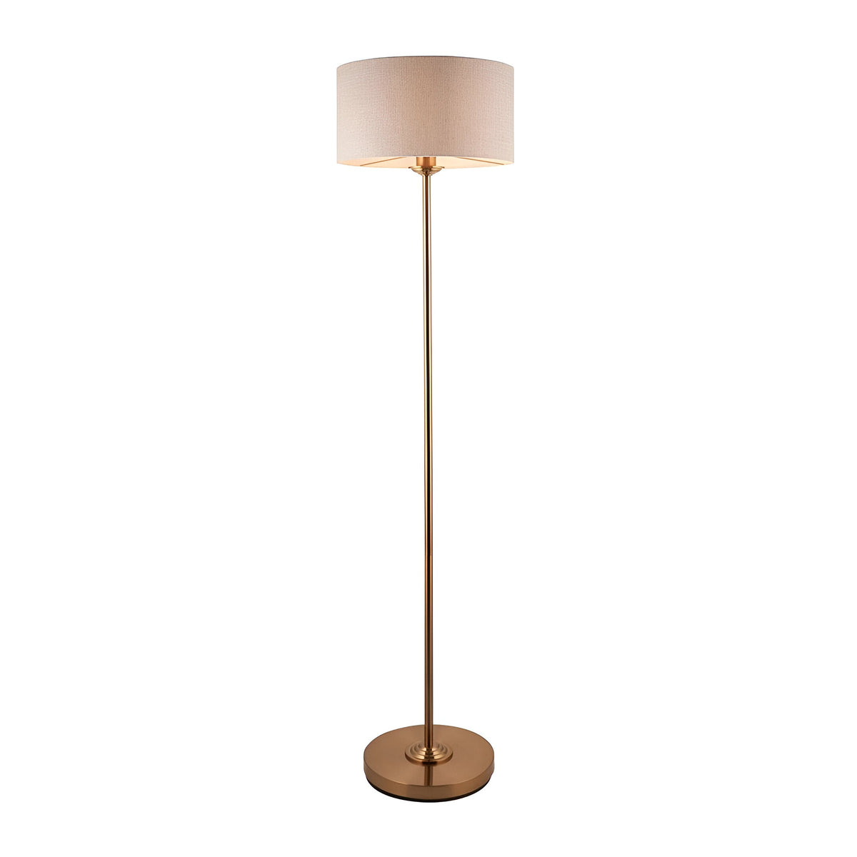 Brenley Floor Lamp in brass with slim tall stem, round base, and drum-shaped fabric shade, shown on a plain white background.
