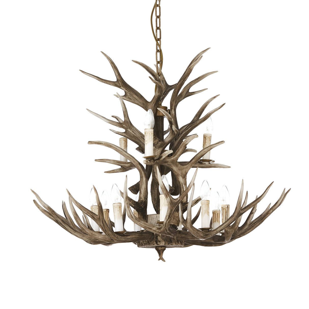 The Flow 12 Light Chandelier - Dark Brown, with its rustic design featuring numerous antlers each holding candle-shaped light bulbs and suspended from a chain, exudes an elegant yet rugged aesthetic complemented by its natural, earthy dark brown finish.