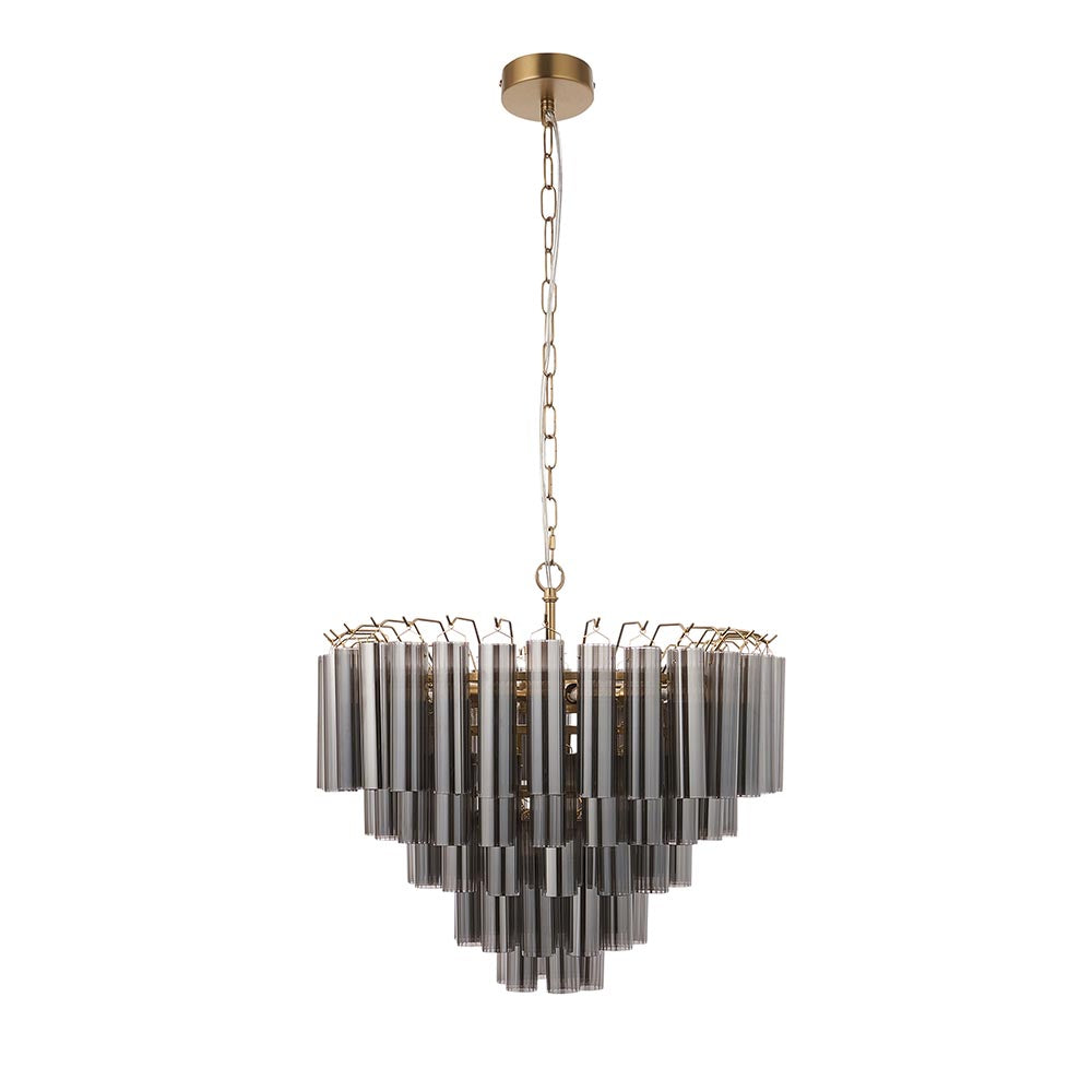 Endon Cranshaw 12 light tiered pendant with smokey grey cylindrical glass on a satin brass frame, hung from a chain against a plain white background.