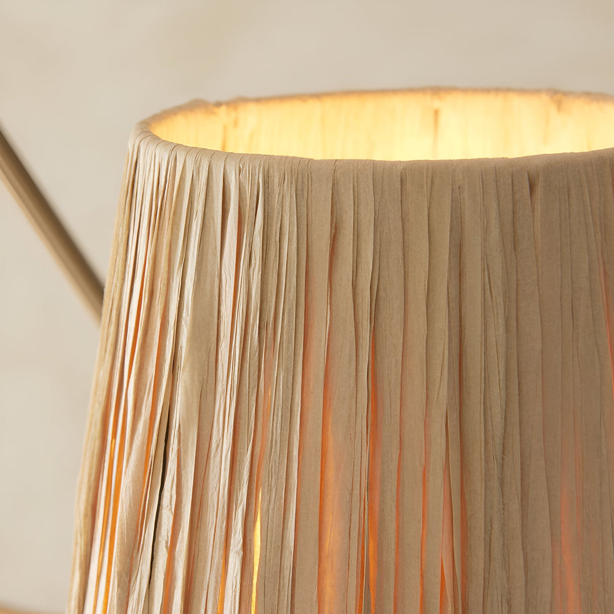 Close-up of the Danemont 3 Light Pendant in brass, showing a raffia-wrapped shade with textured natural strands and warm interior glow.