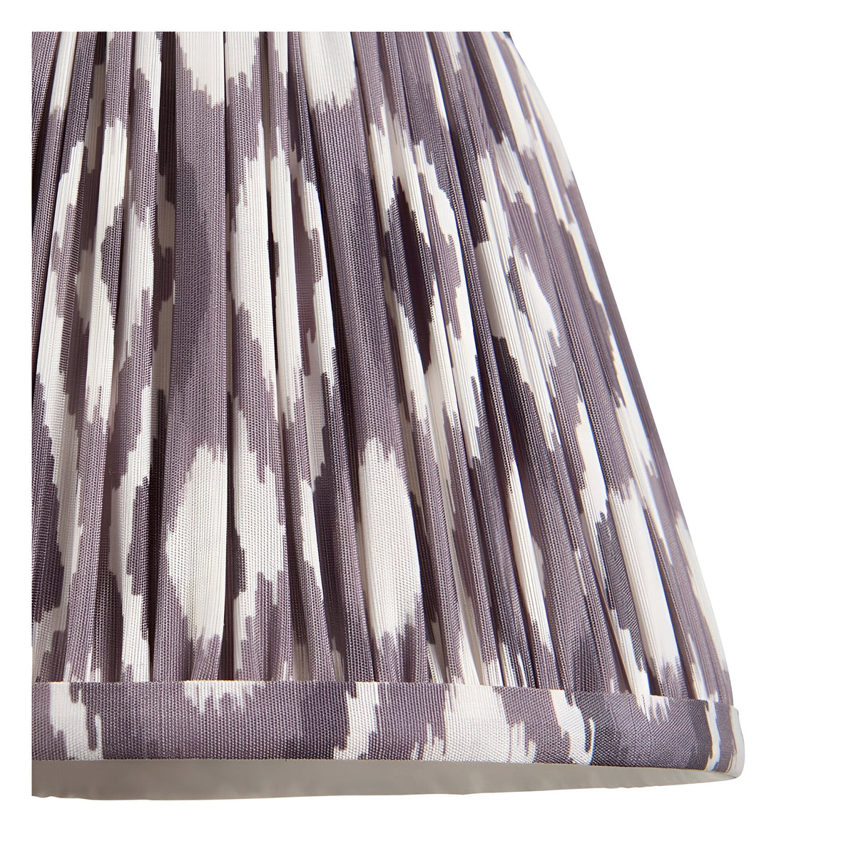 Close-up of the Bevbury Ikat wall light's pleated fabric shade in grey and white ikat pattern, showing gathered folds and trim edge.