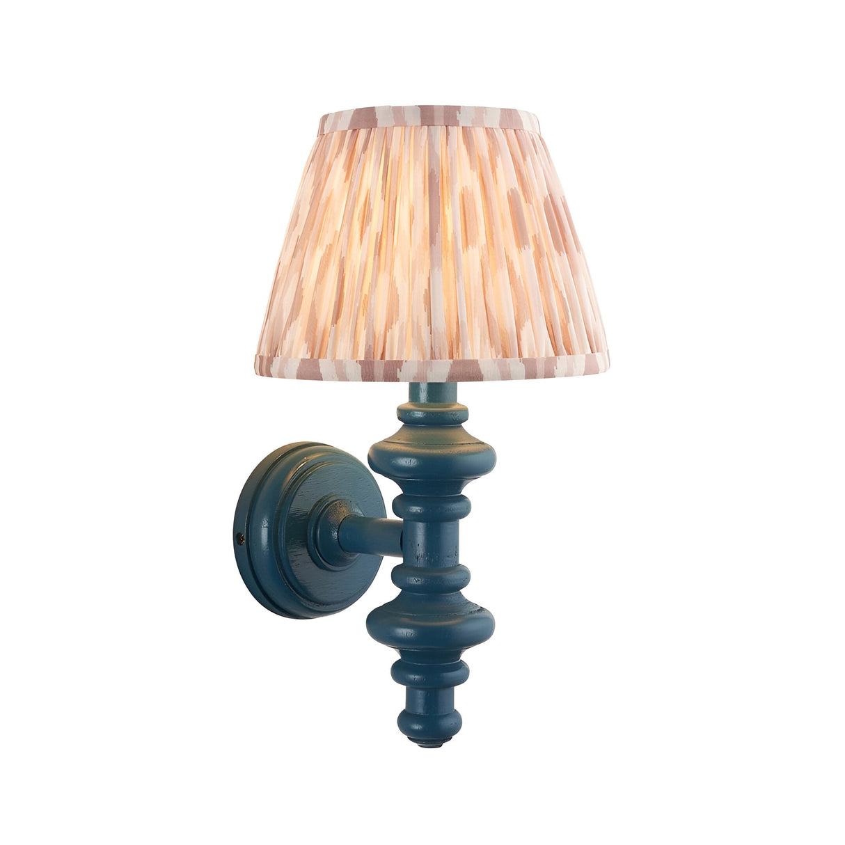 Endon Bevbury Ikat wall light with turned blue wooden spindle, brass B22 holder and tapered pleated pink ikat faux silk shade on a white background.