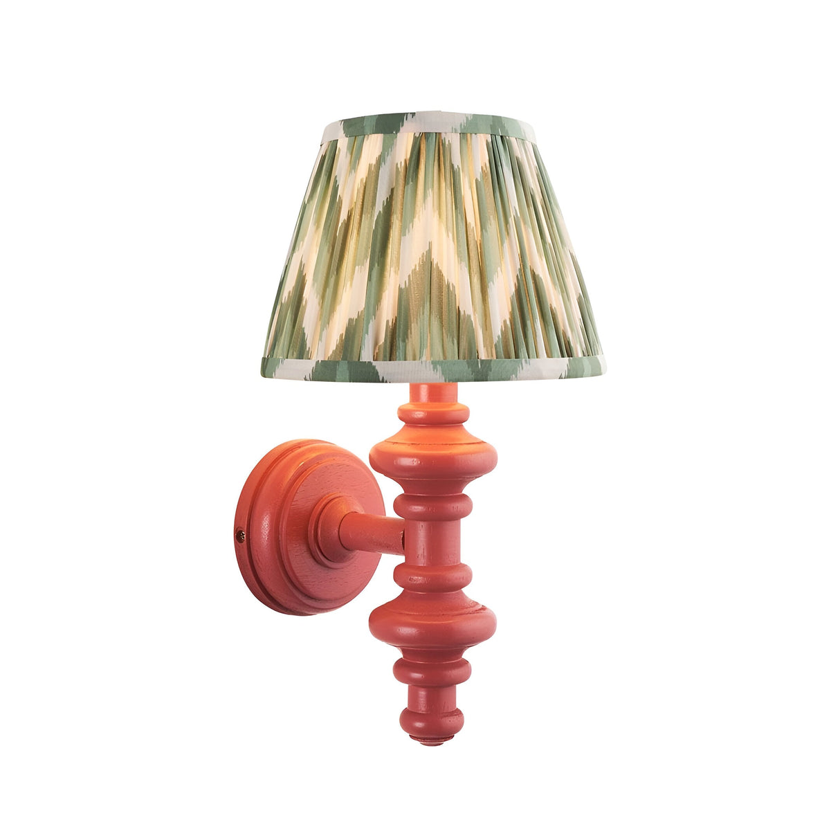 Endon Bevbury Zigzag wall light with turned pink spindle base, brass B22 lamp holder and pleated green zigzag faux silk shade, on white.