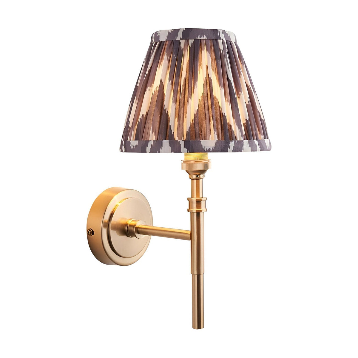Endon Bevford Zigzag wall light in aged brass with a pleated grey faux silk tapered shade in zigzag print, shown on a plain white background.