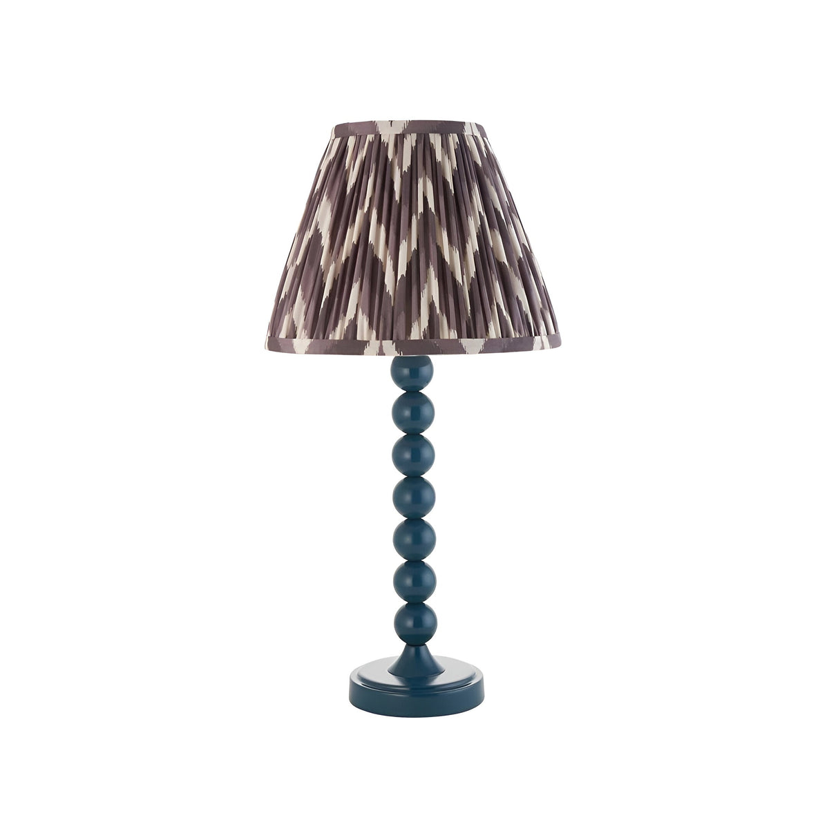 Endon Brenleigh Zigzag table lamp with a blue gloss stacked-sphere metal base and grey and cream pleated zigzag fabric shade on a white background.