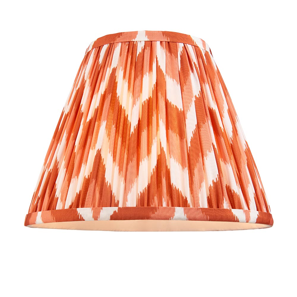 Brenleigh Zigzag Table Lamp shade in pleated orange and white zigzag faux silk with matching trim, shown on a plain white background.