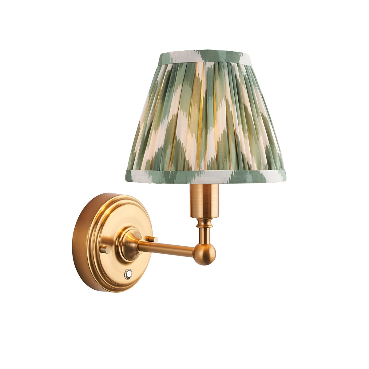 Endon Ashstead LED wall light with a pleated green and white zigzag fabric shade on a brushed aged brass arm and round backplate.
