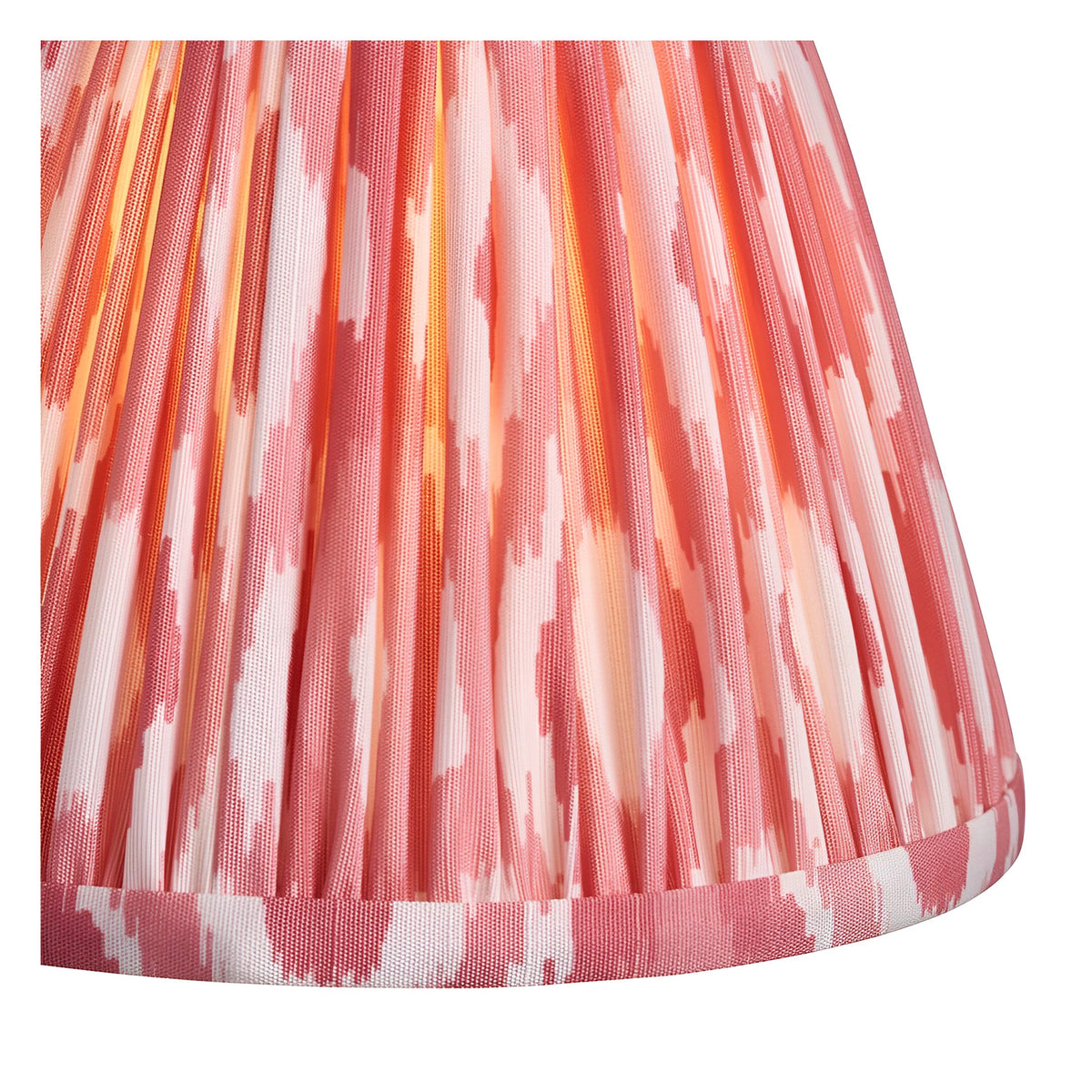 Close-up of the Endon Carlwood LED table lamp's handmade Ikat shade in coral pink and white pleated faux silk.
