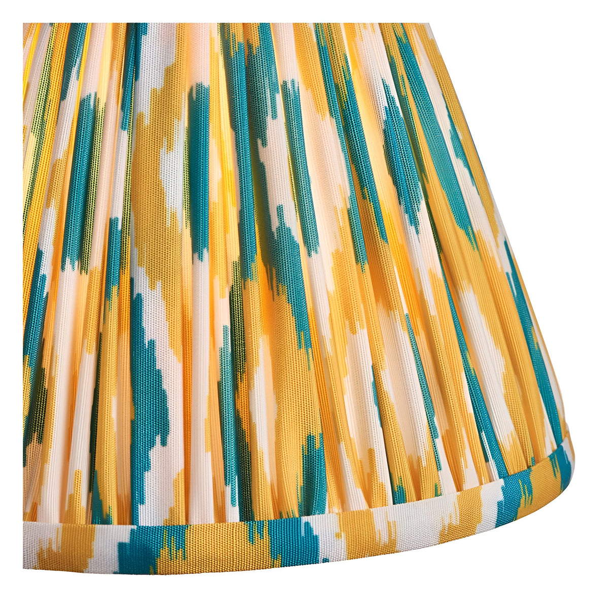 Close-up of the Cranwick LED table lamp's pleated fabric shade in an Ikat pattern, showing yellow, teal, and white tones with a woven trim edge.