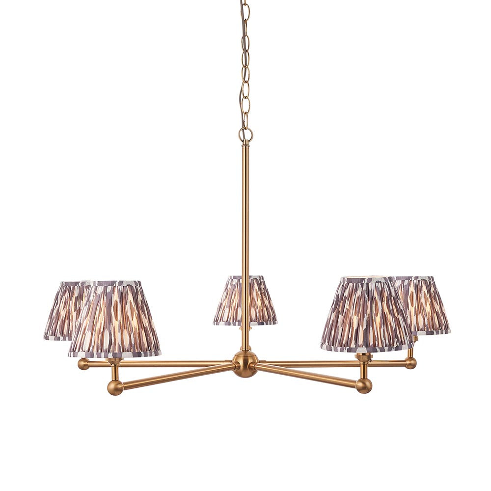 Cliffleigh Ikat 5 Light Pendant with brushed brass frame and pleated grey Ikat-patterned fabric shades, hung from a chain on a white background.