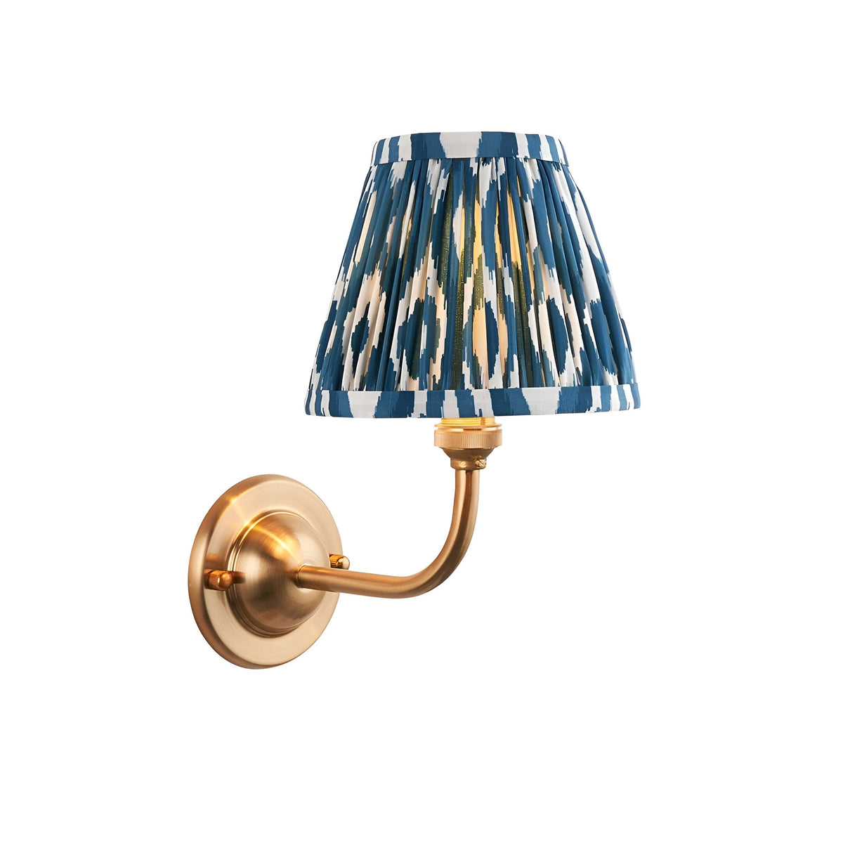 Endon Brackdale Ikat wall light with brushed aged brass curved arm and pleated blue and white ikat faux silk shade on a plain white background.