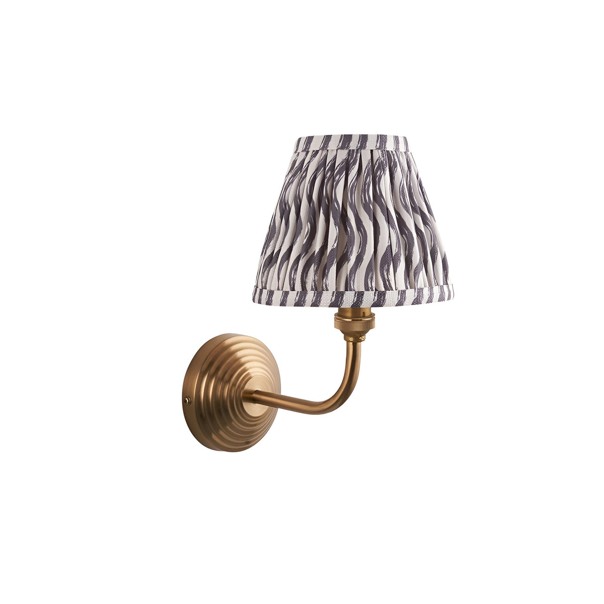 Endon Castgrove Ripple wall light with brushed aged brass stepped backplate, curved arm and pleated grey faux linen ripple shade on white.