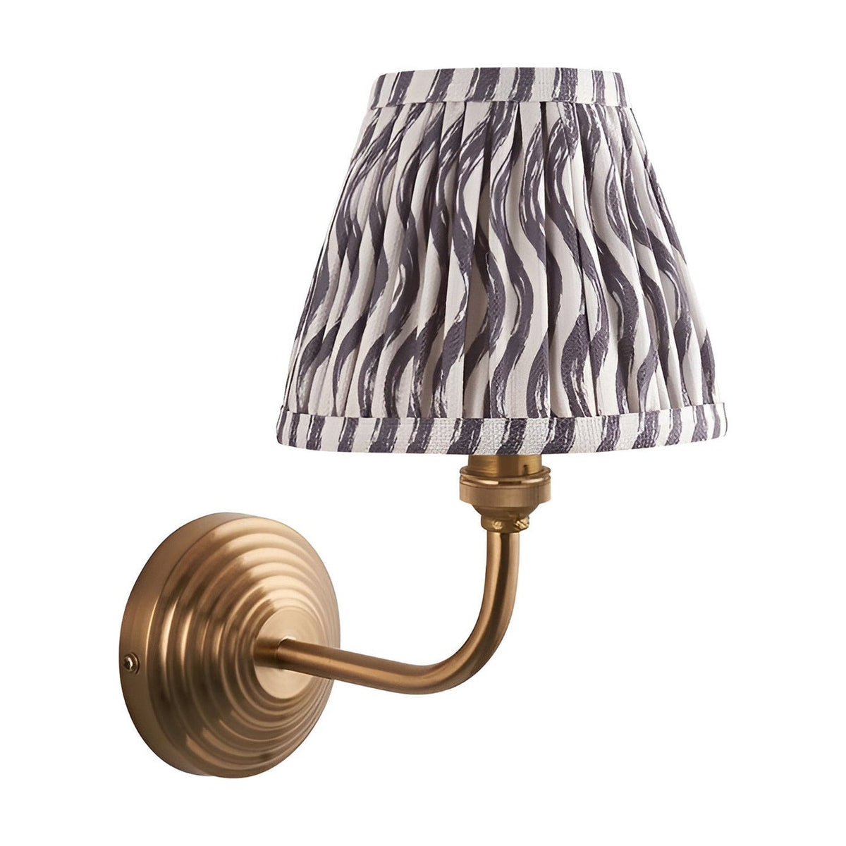 Endon Castgrove Ripple wall light with brushed aged brass stepped backplate, curved arm and pleated grey faux linen ripple shade on white.