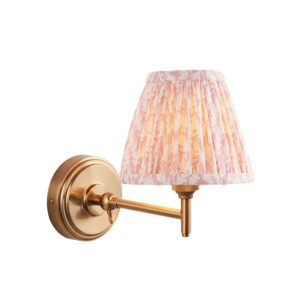 Cliffwood Leaf Wall Light in brushed brass with an adjustable knuckle arm and pleated leaf-print fabric shade, shown on a plain white background.