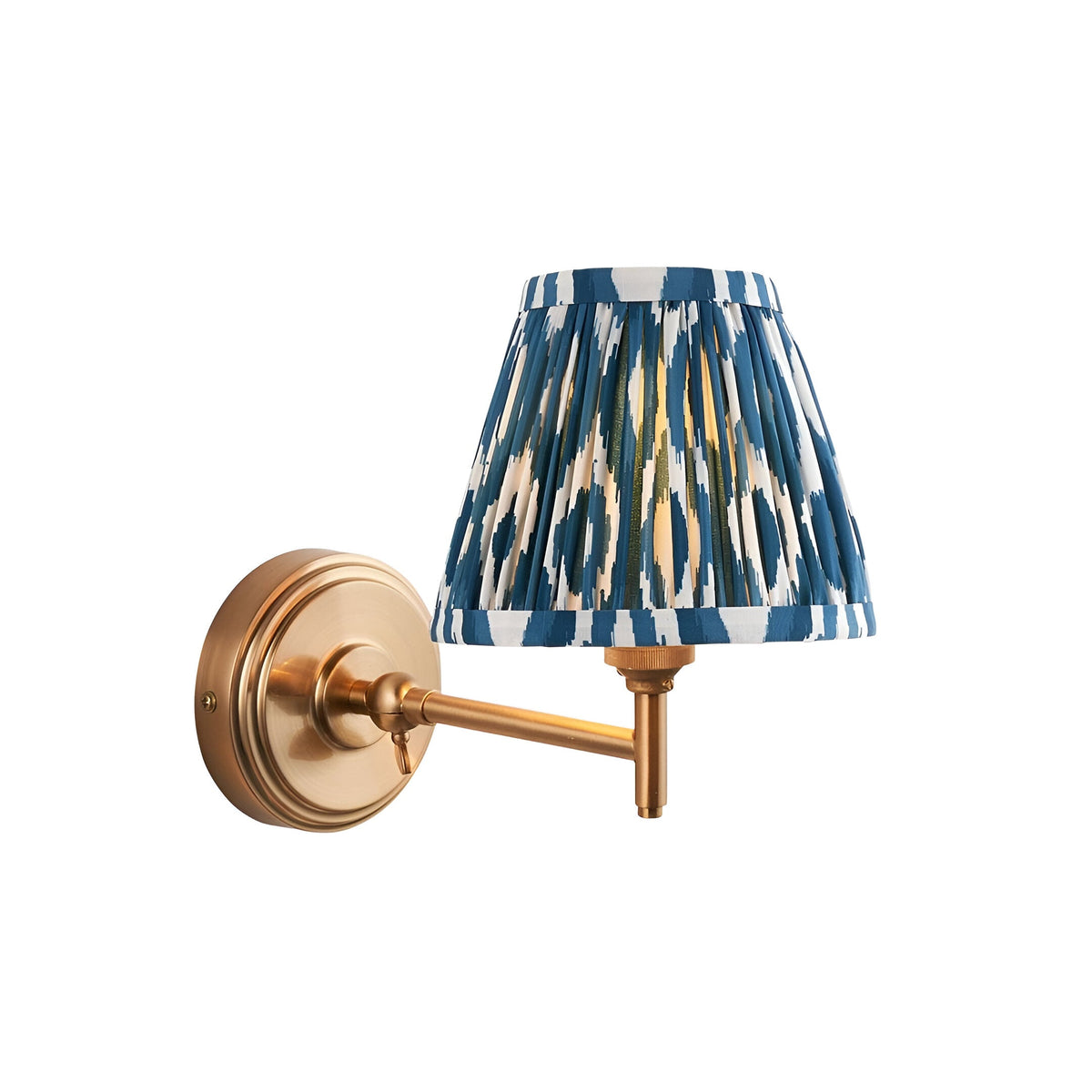 Cliffwood Ikat Wall Light in brushed brass, with a linear adjustable arm and a pleated blue and white Ikat-patterned fabric shade, shown on a white background.