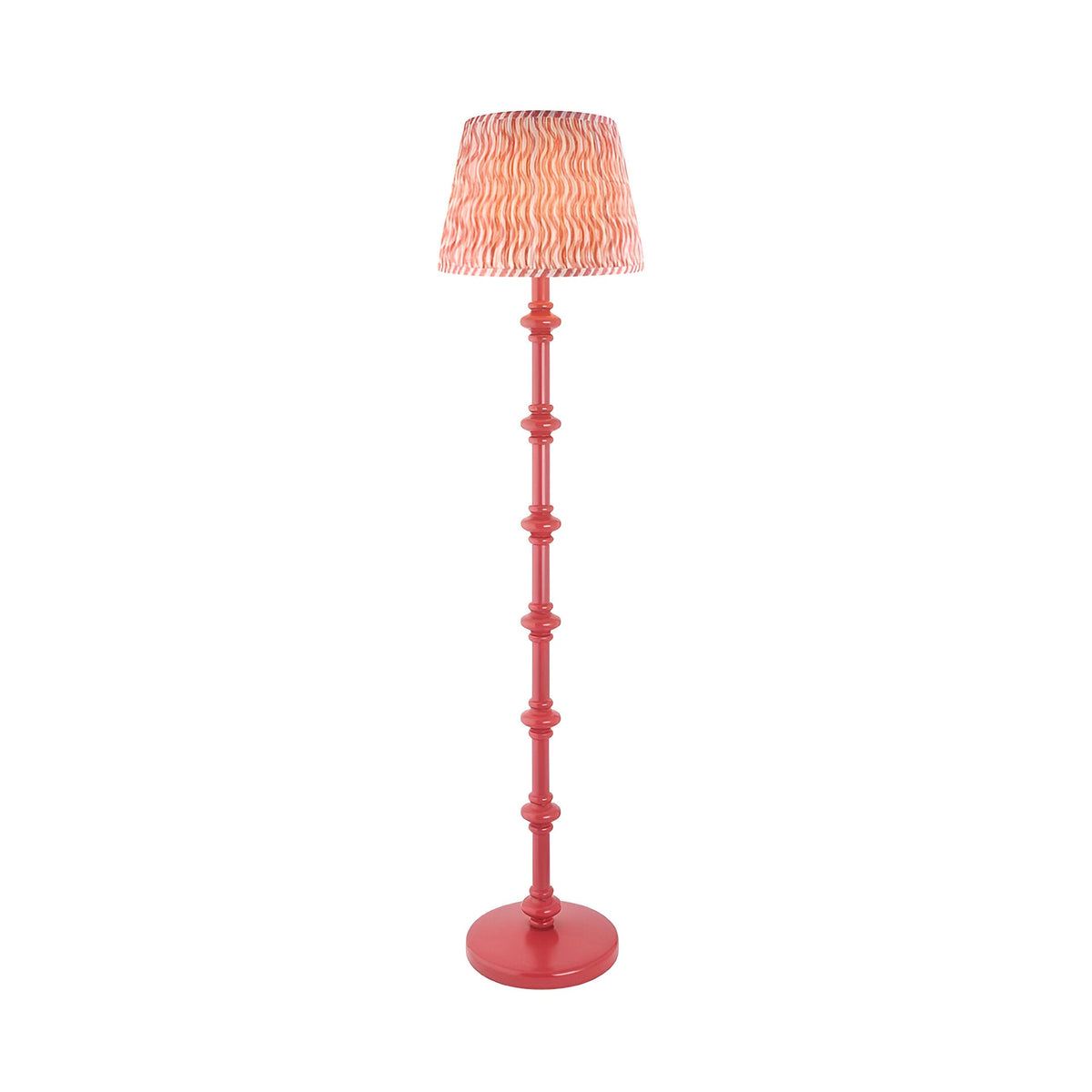Endon Bevbury Ripple floor lamp with coral turned wooden spindle base and pink patterned faux linen tapered shade on a plain background.