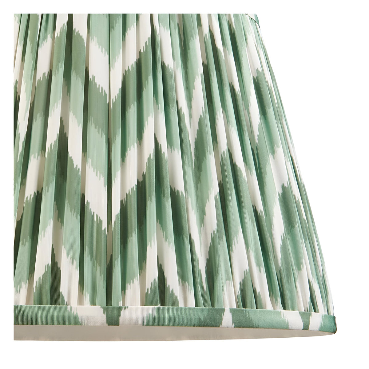 Close-up of the Endon Bevbury Zigzag floor lamp's pleated faux silk shade in green and white ikat chevron pattern with taped edge detail.