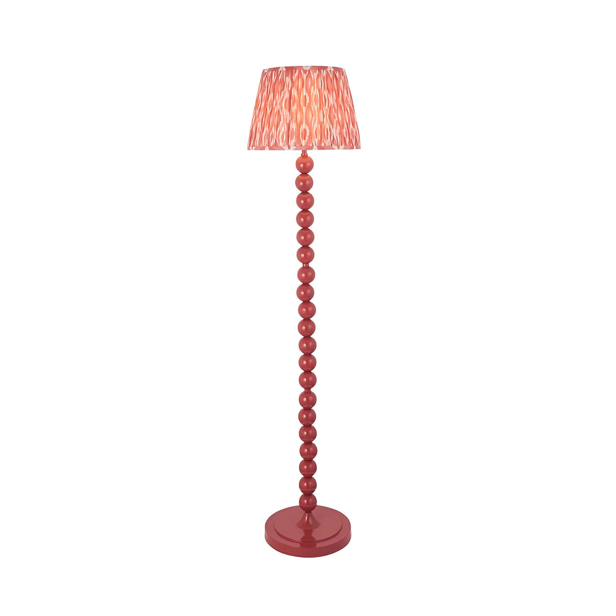 Endon Brenleigh floor lamp in pink with stacked sphere glossy metal base and pleated Ikat faux silk shade, shown on a plain white background.