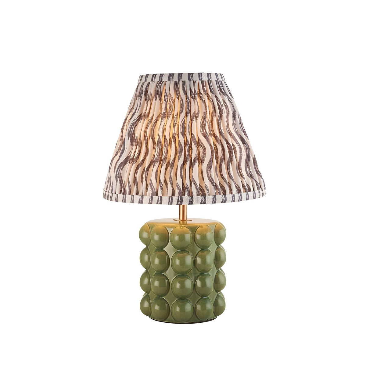 Endon Amberley Ripple table lamp with olive green ceramic bobble base, aged brass stem and pleated grey wave-print shade on a white background.