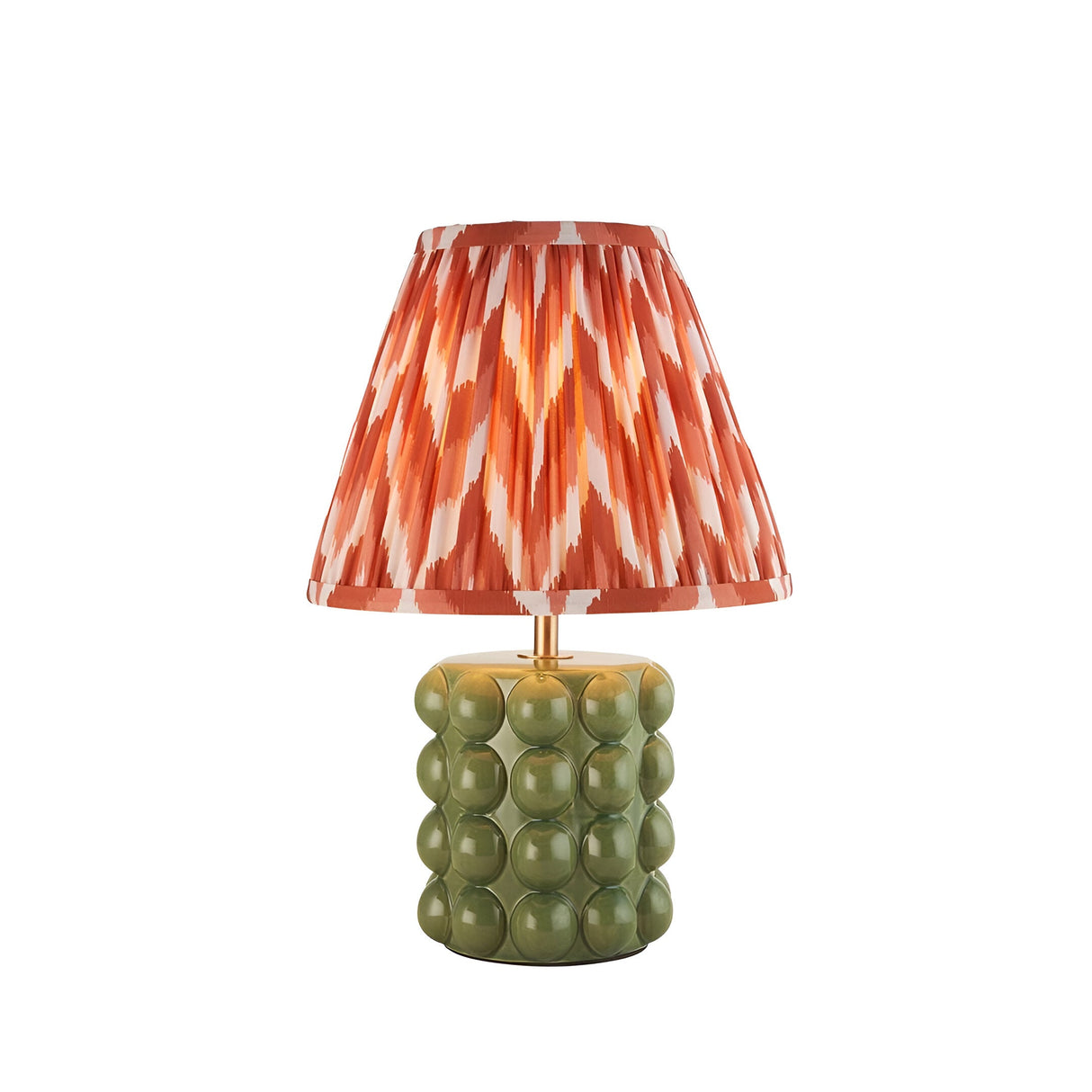 Endon Amberley table lamp with glossy olive green bobble ceramic base, aged brass stem, and pleated apricot orange zigzag shade on a white background.