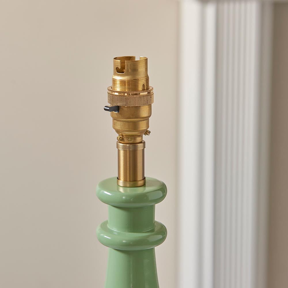 Carlworth Zigzag Table Lamp base close-up showing brass B22 bulb holder and switch atop a green resin turned spindle stem.